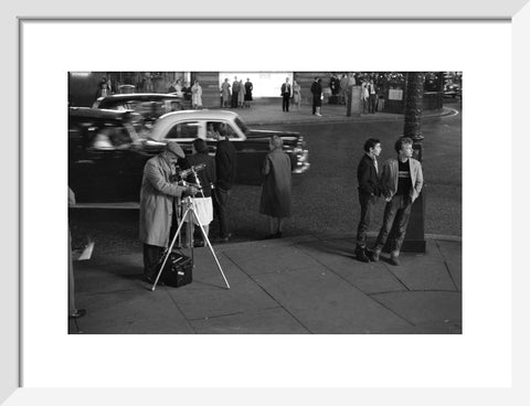 Photographer recording the nightlife c.1960