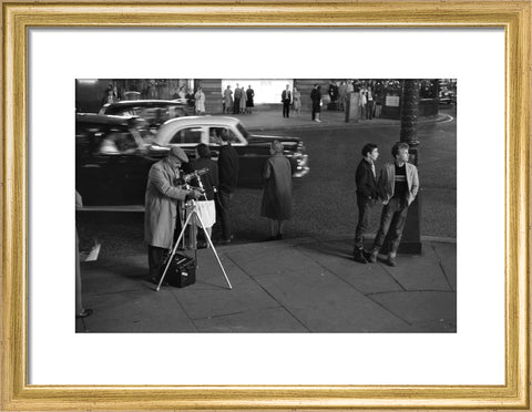 Photographer recording the nightlife c.1960