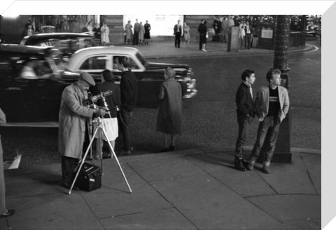 Photographer recording the nightlife c.1960