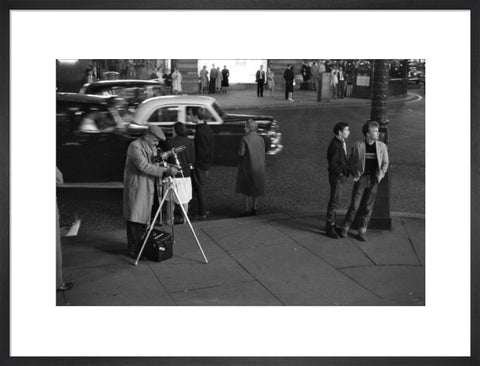 Photographer recording the nightlife c.1960