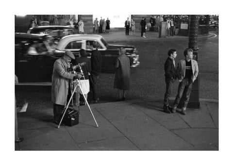 Photographer recording the nightlife c.1960