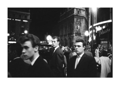 Passers-by on a London street at night c.1955