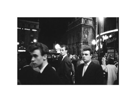 Passers-by on a London street at night c.1955