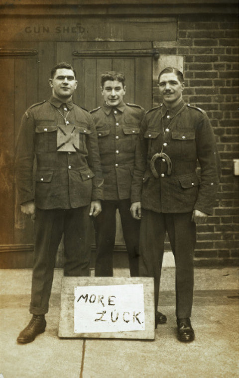 Three soldiers stand with a message of Hope c.1914