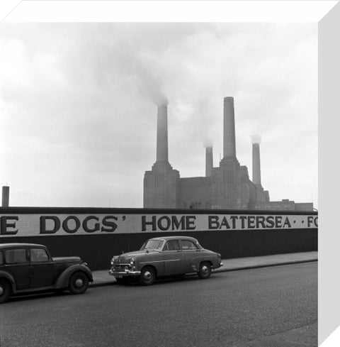 Two parked cars with Battersea Power Station in the background. c.1955