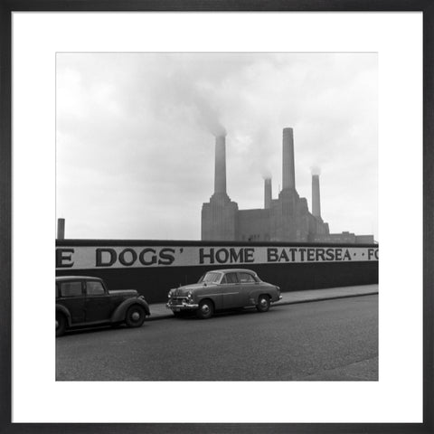 Two parked cars with Battersea Power Station in the background. c.1955