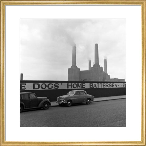 Two parked cars with Battersea Power Station in the background. c.1955