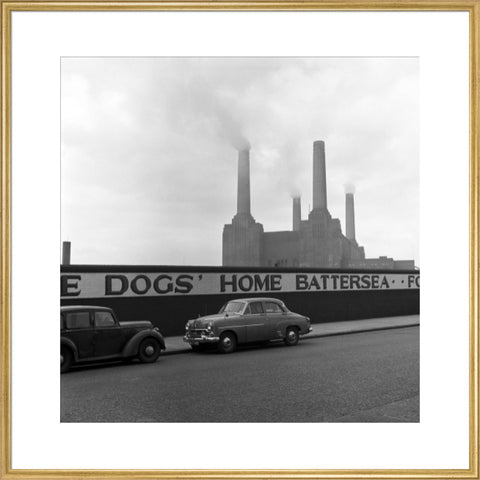 Two parked cars with Battersea Power Station in the background. c.1955