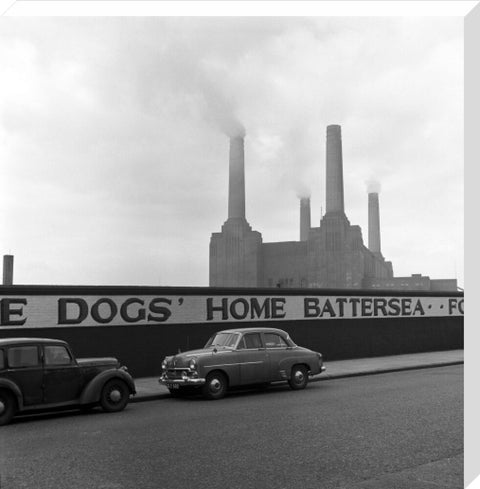 Two parked cars with Battersea Power Station in the background. c.1955