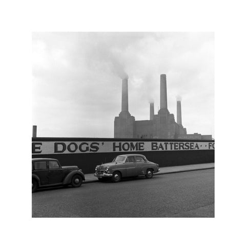 Two parked cars with Battersea Power Station in the background. c.1955