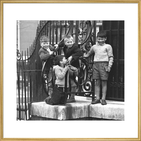Four boys by railings. c.1955