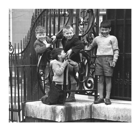 Four boys by railings. c.1955