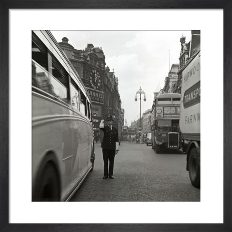 A policeman directing traffic New Oxford Street. c.1955