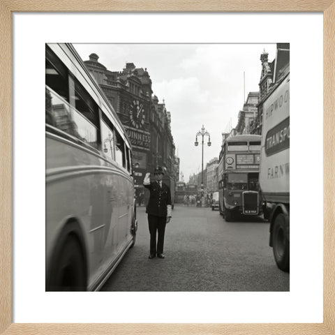 A policeman directing traffic New Oxford Street. c.1955