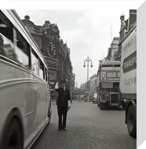 A policeman directing traffic New Oxford Street. c.1955