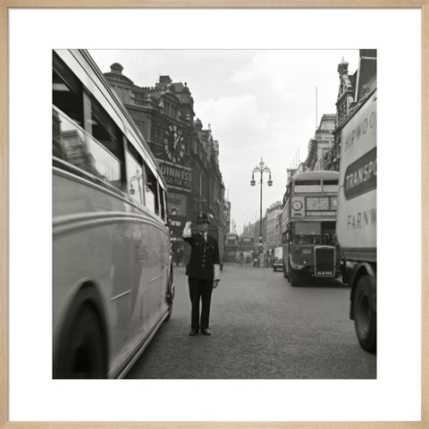 A policeman directing traffic New Oxford Street. c.1955