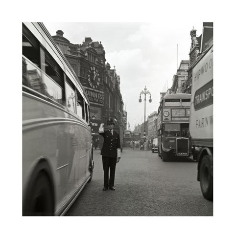 A policeman directing traffic New Oxford Street. c.1955