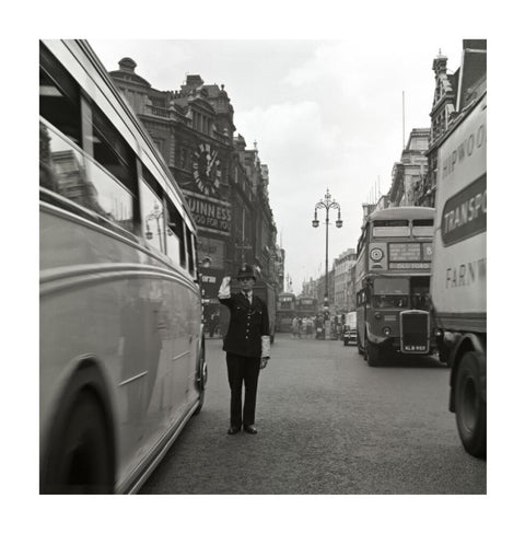 A policeman directing traffic New Oxford Street. c.1955