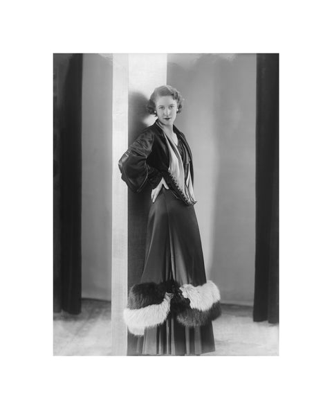 Image of a woman modeling a an evening coat 1932