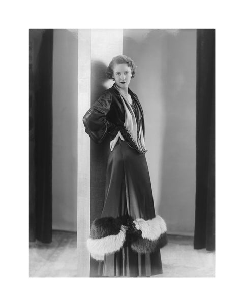 Image of a woman modeling a an evening coat 1932