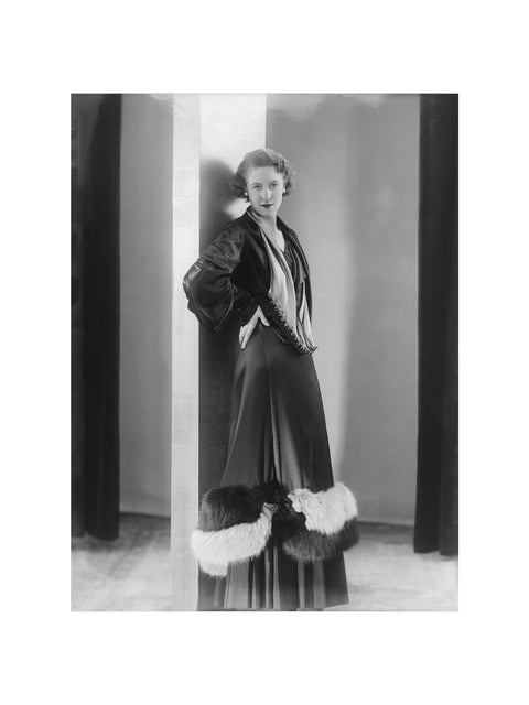 Image of a woman modeling a an evening coat 1932