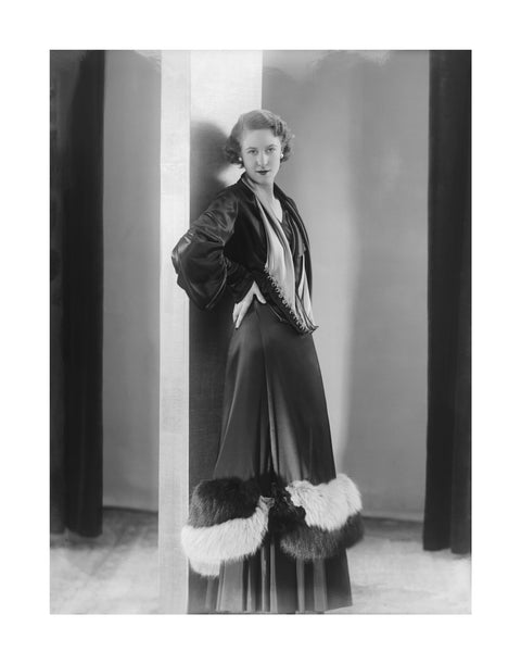 Image of a woman modeling a an evening coat 1932