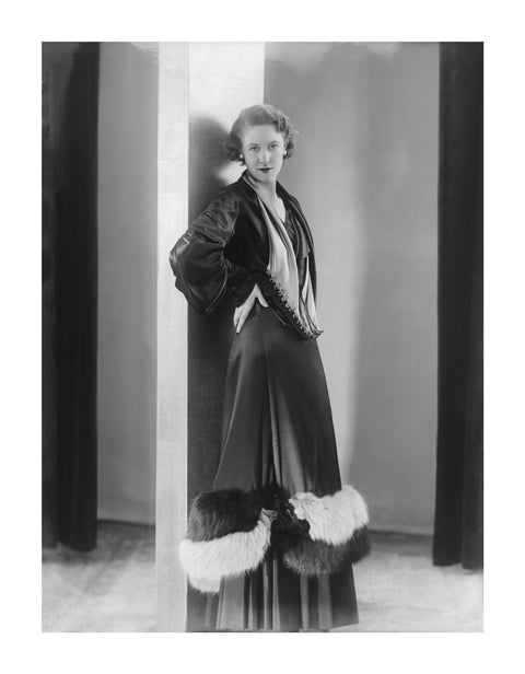 Image of a woman modeling a an evening coat 1932